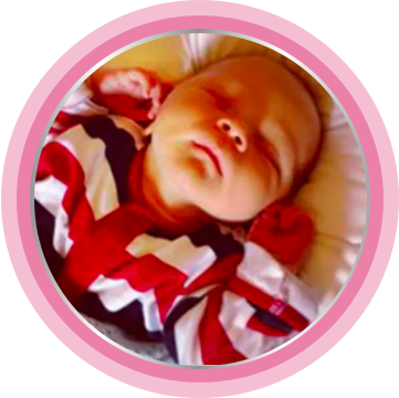 Newborn baby sleeping well after nappy rash cream was applied.
