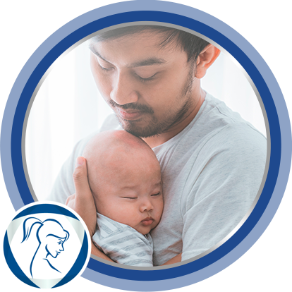 Father carrying baby after applying Bepanthen moisturizing cream